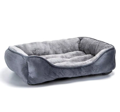 Large dog sofa bed with raised bolsters and soft plush fabric for comfort